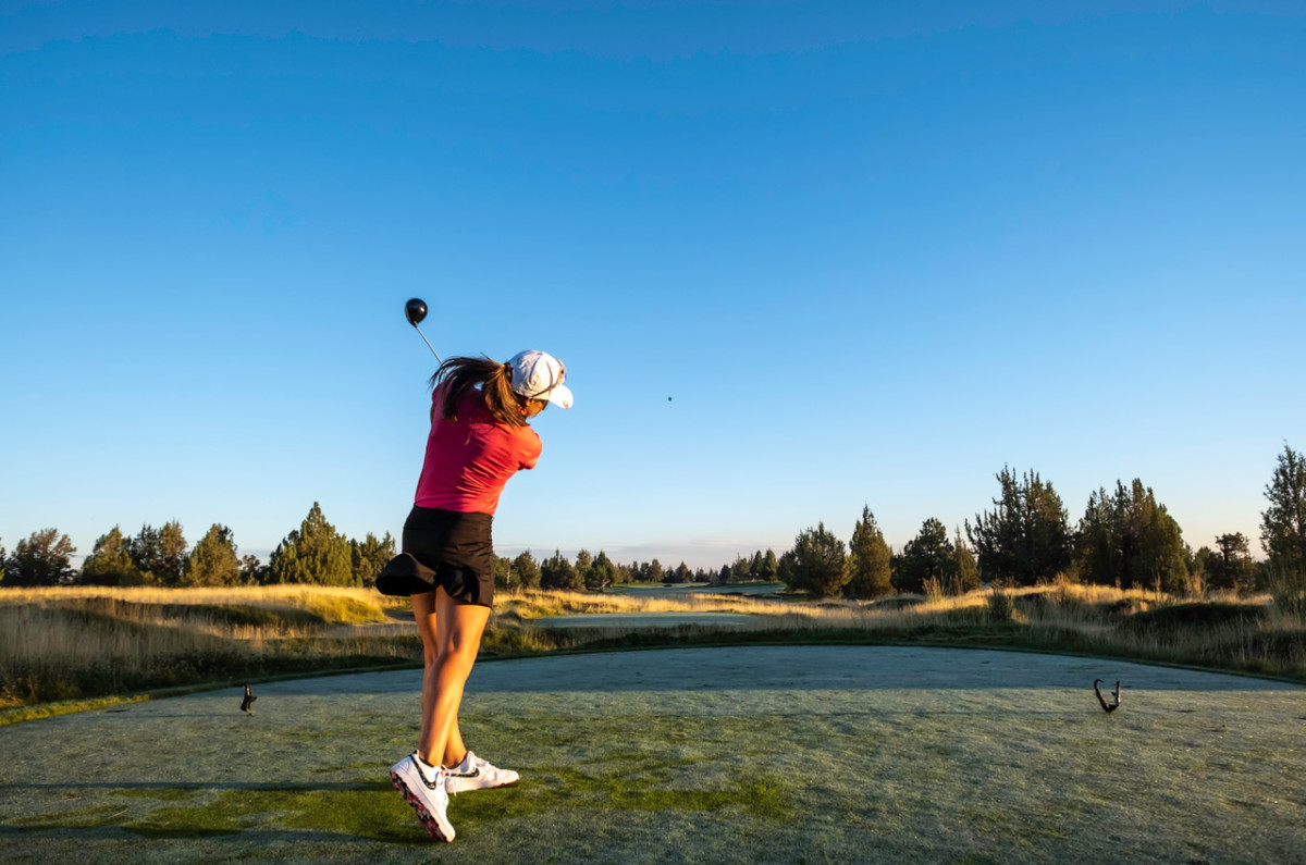 Golfer in red at Pronghorn golf resort